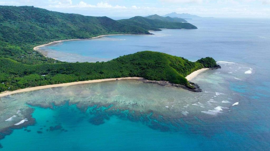 an aerial view of an island in the ocean at Wai Makare Homestay in Naviti Island