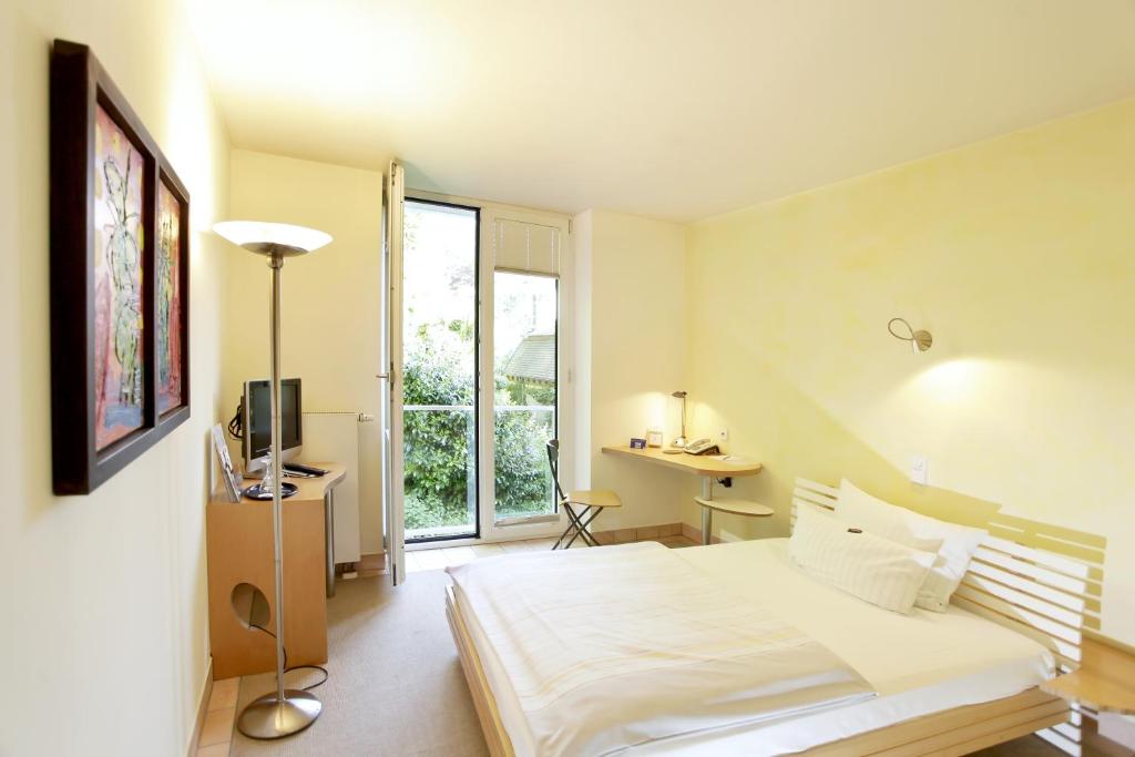 Postel nebo postele na pokoji v ubytování Hotel Watthalden