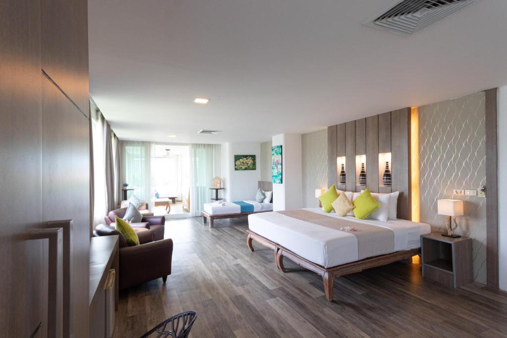 Postel nebo postele na pokoji v ubytování Aochalong Villa Resort & Spa - SHA Plus