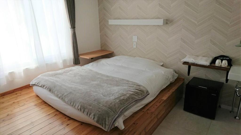 Un pat sau paturi într-o cameră la Sarabetsu-mura chiiki Kouryu Center - Vacation STAY 25698v