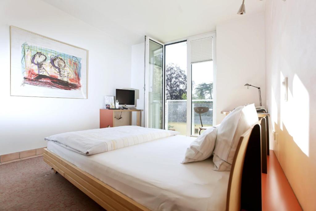 Postel nebo postele na pokoji v ubytování Hotel Watthalden