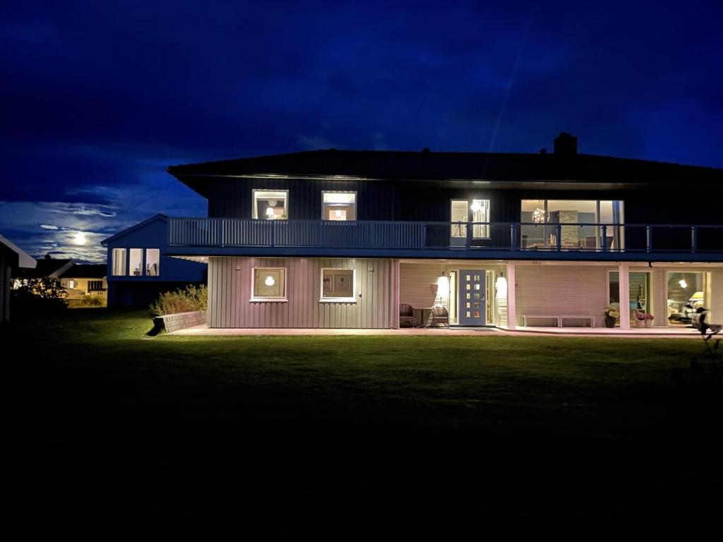a large house at night with its lights on at Apartment Utsikten in Andenes
