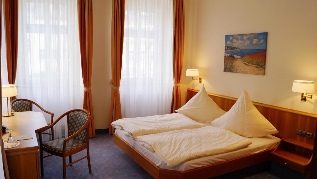 Ένα ή περισσότερα κρεβάτια σε δωμάτιο στο Hotel Goldener Löwe
