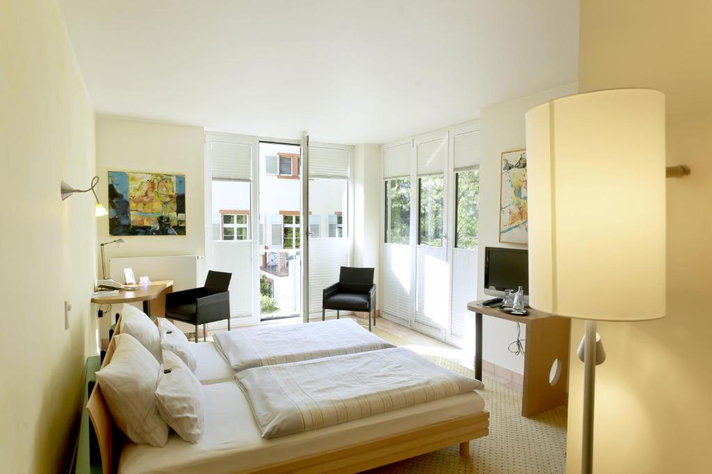 Postel nebo postele na pokoji v ubytování Hotel Watthalden