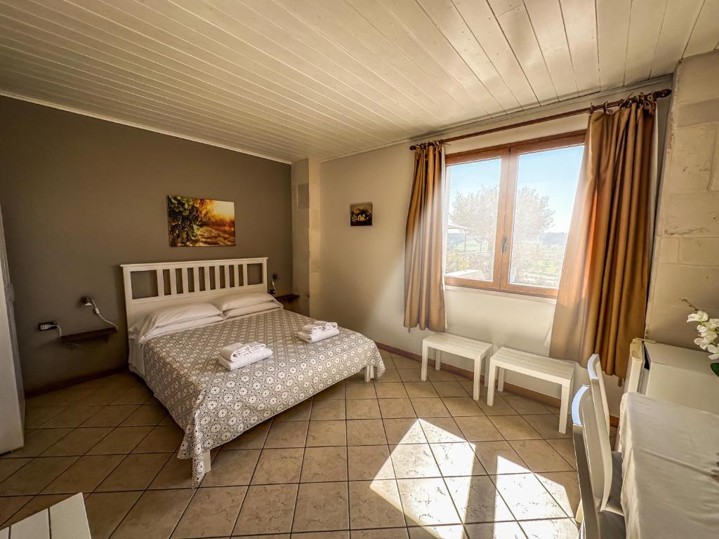 Letto o letti in una camera di B&B Il Leccio