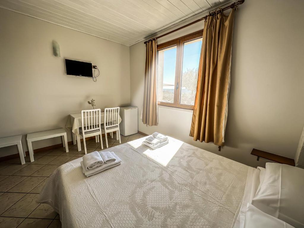 Letto o letti in una camera di B&B Il Leccio