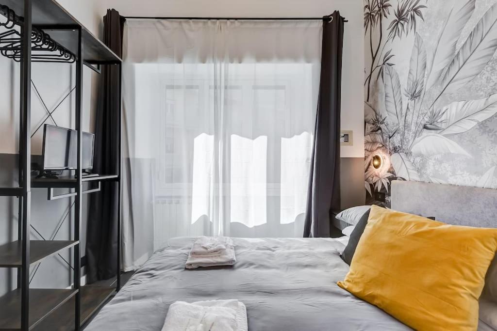 A bed or beds in a room at Classy Apt in the richest Rome