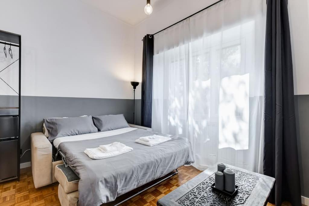 A bed or beds in a room at Classy Apt in the richest Rome