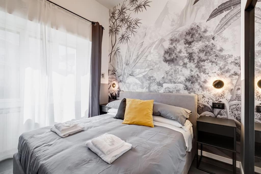 A bed or beds in a room at Classy Apt in the richest Rome