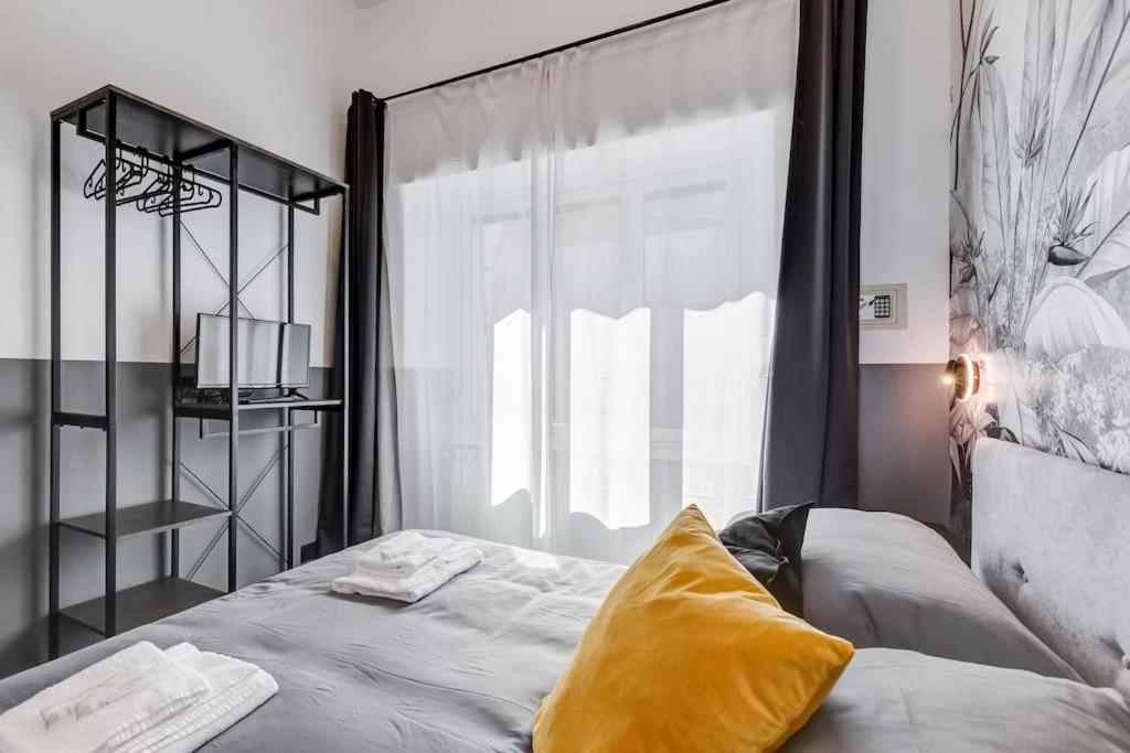 A bed or beds in a room at Classy Apt in the richest Rome