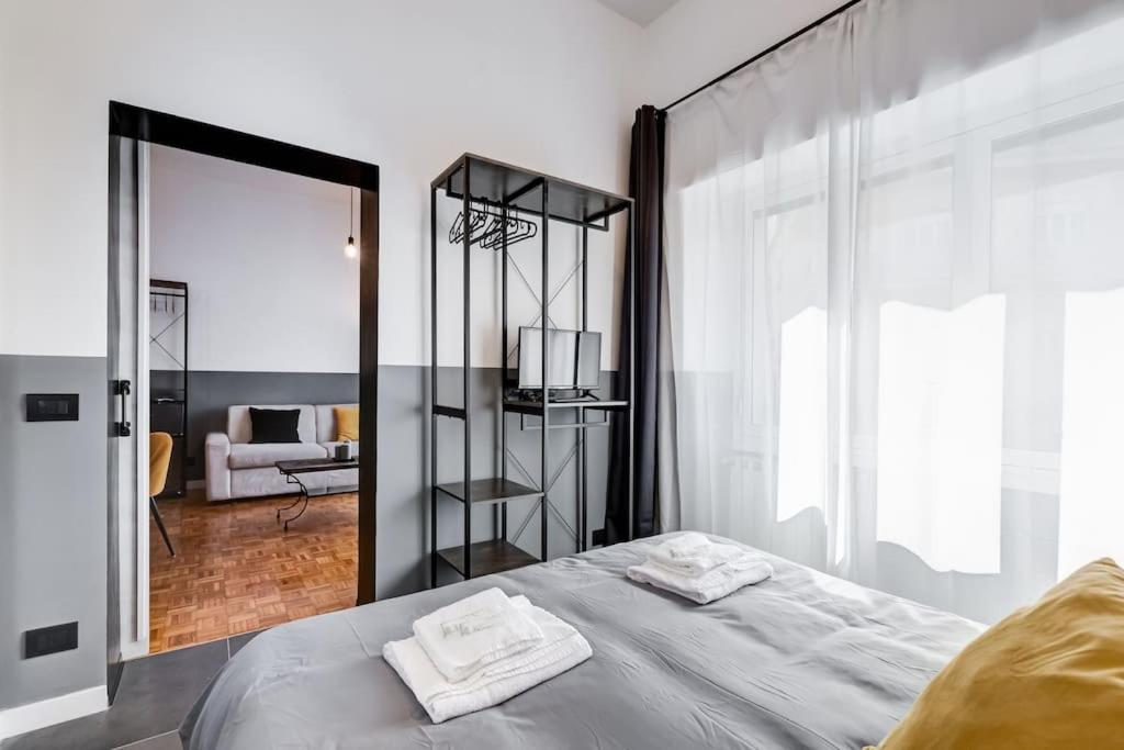 A bed or beds in a room at Classy Apt in the richest Rome