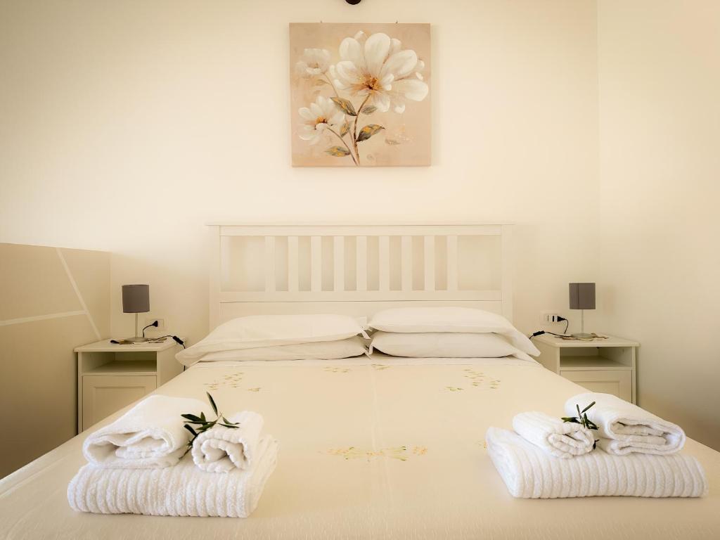 Letto o letti in una camera di B&B Il Leccio