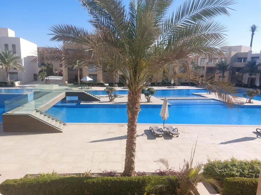 The swimming pool at or close to Mangroovy - 2BR La Blanca Pool View