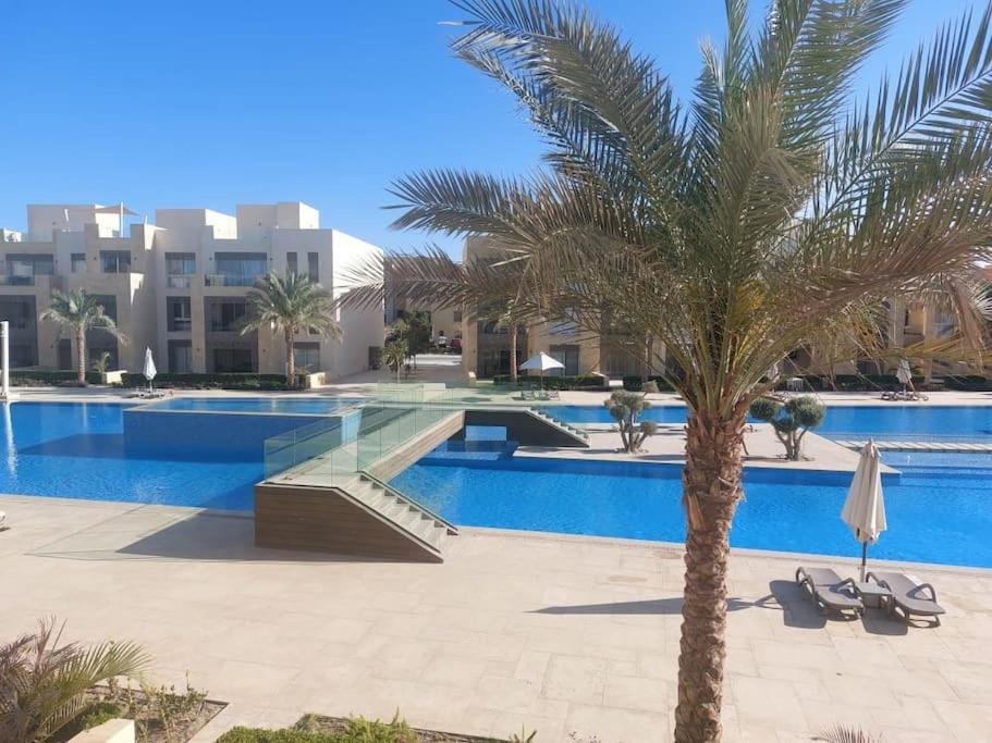 The swimming pool at or close to Mangroovy - 2BR La Blanca Pool View