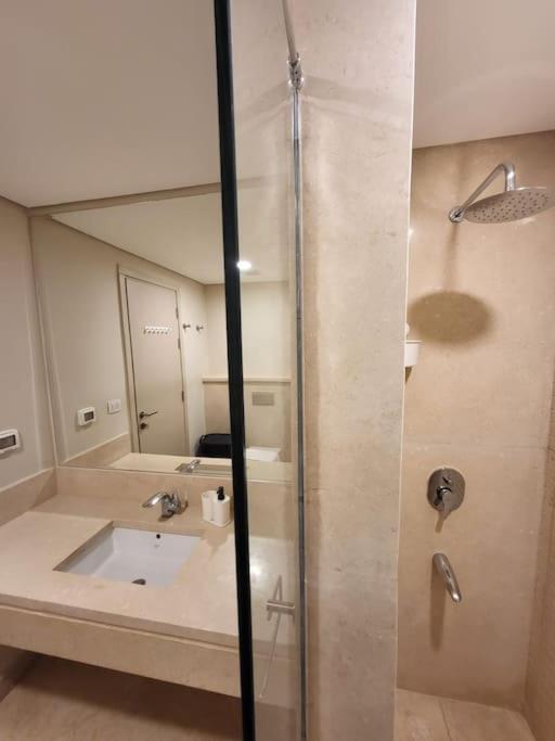 A bathroom at Mangroovy - 2BR La Blanca Pool View
