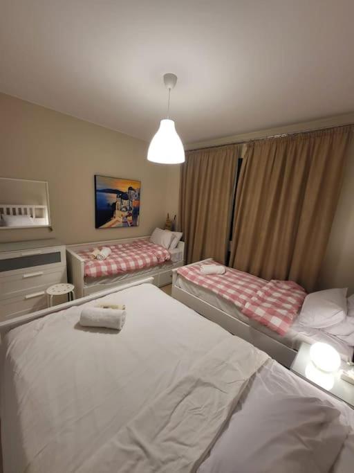 A bed or beds in a room at Mangroovy - 2BR La Blanca Pool View