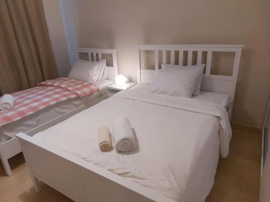 A bed or beds in a room at Mangroovy - 2BR La Blanca Pool View