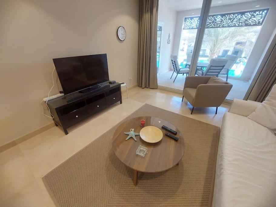 A television and/or entertainment centre at Mangroovy - 2BR La Blanca Pool View