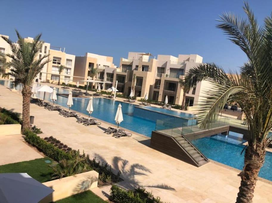 The swimming pool at or close to Mangroovy - 2BR La Blanca Pool View
