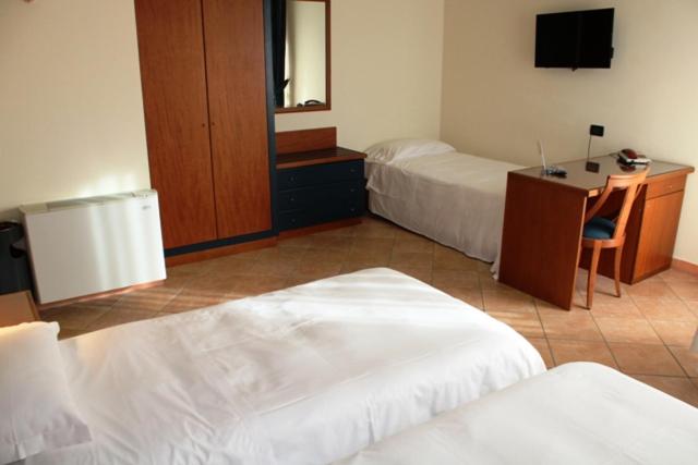 Postel nebo postele na pokoji v ubytování DOMUS Grand Hotel