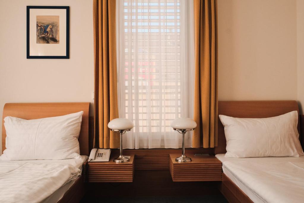 Postel nebo postele na pokoji v ubytování Hotel Exel
