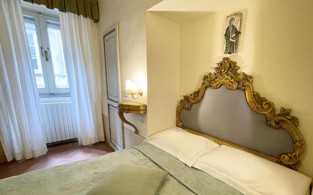 Postel nebo postele na pokoji v ubytování Hotel San Michele