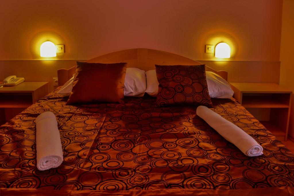 Postel nebo postele na pokoji v ubytování Hotel Art