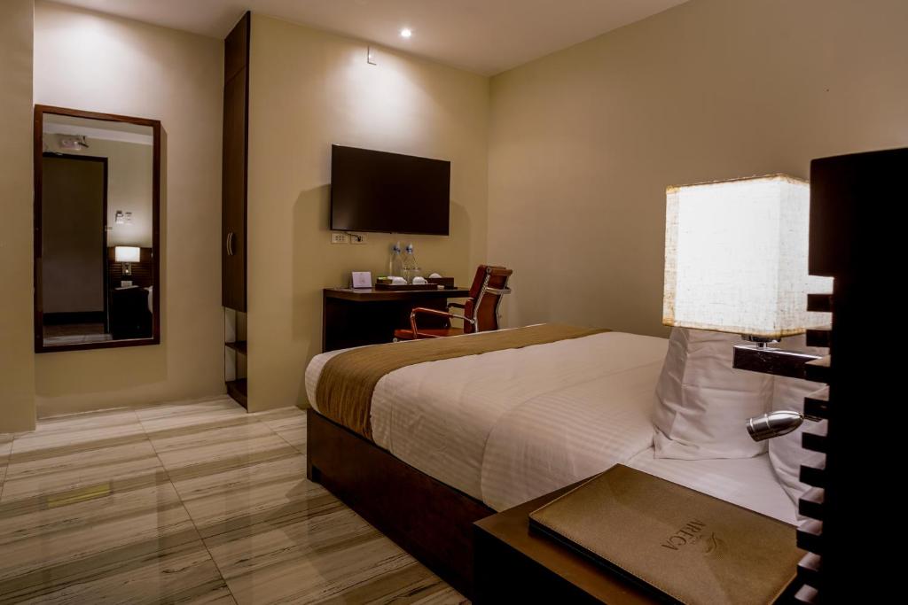 Postel nebo postele na pokoji v ubytování Hotel Areca