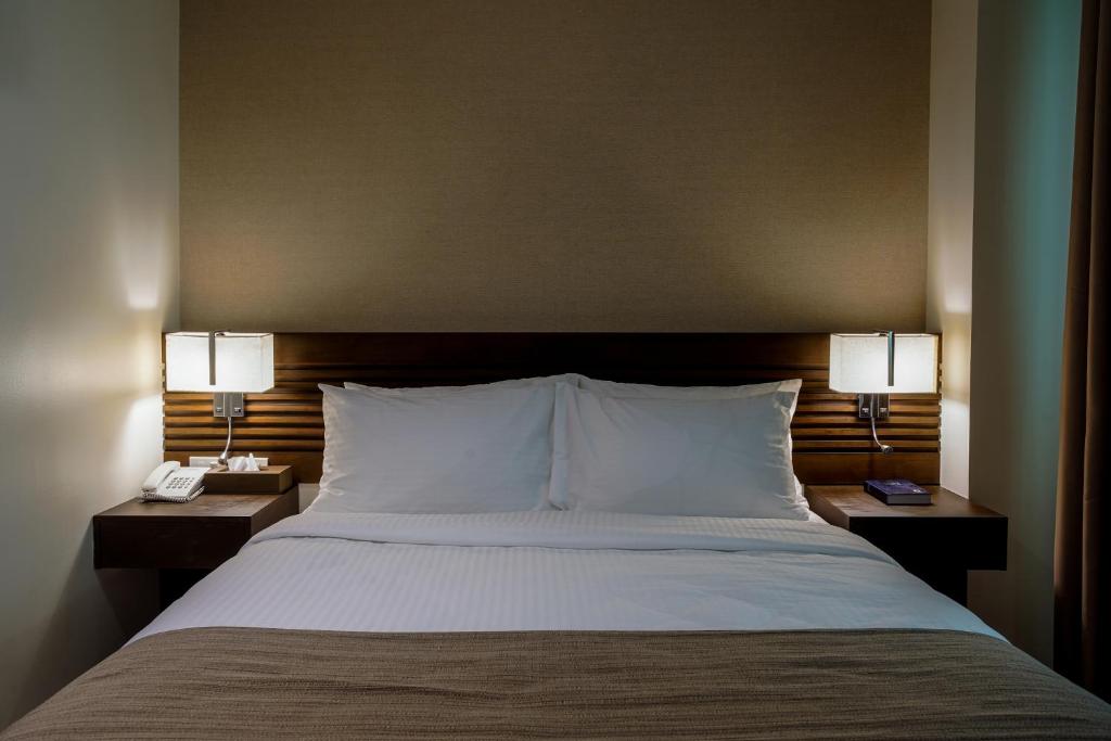 Postel nebo postele na pokoji v ubytování Hotel Areca