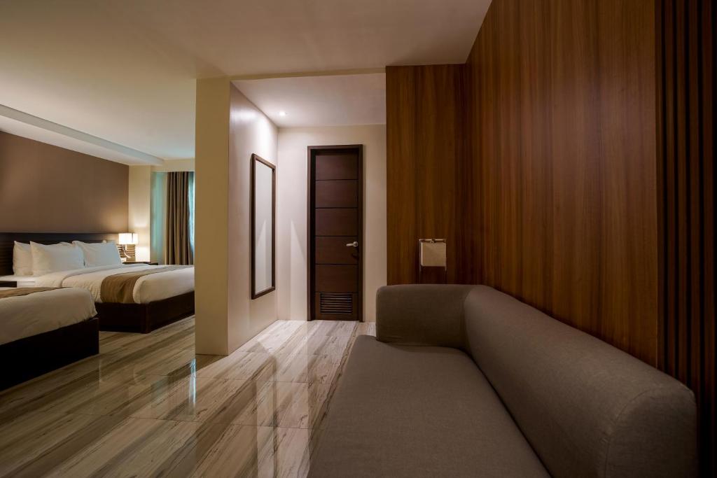 Postel nebo postele na pokoji v ubytování Hotel Areca
