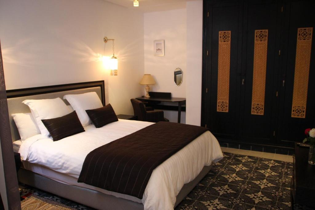 Ένα ή περισσότερα κρεβάτια σε δωμάτιο στο Dar Souran