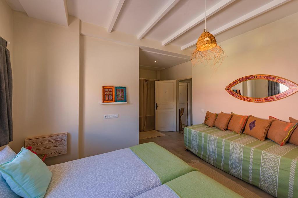 Postel nebo postele na pokoji v ubytování Kite House Dakhla