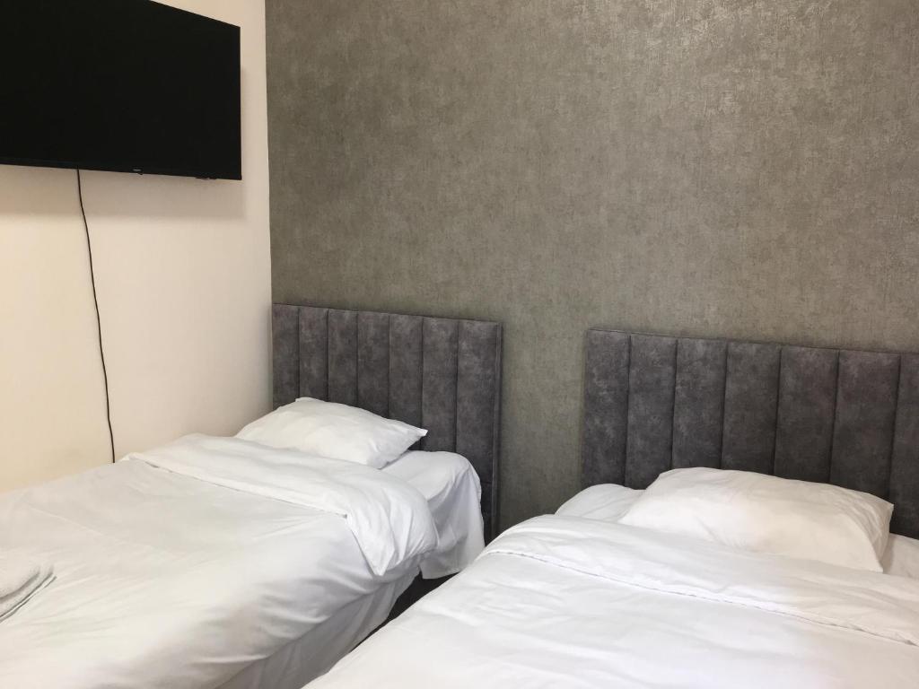 Postel nebo postele na pokoji v ubytování RP HOTEL (NEW)