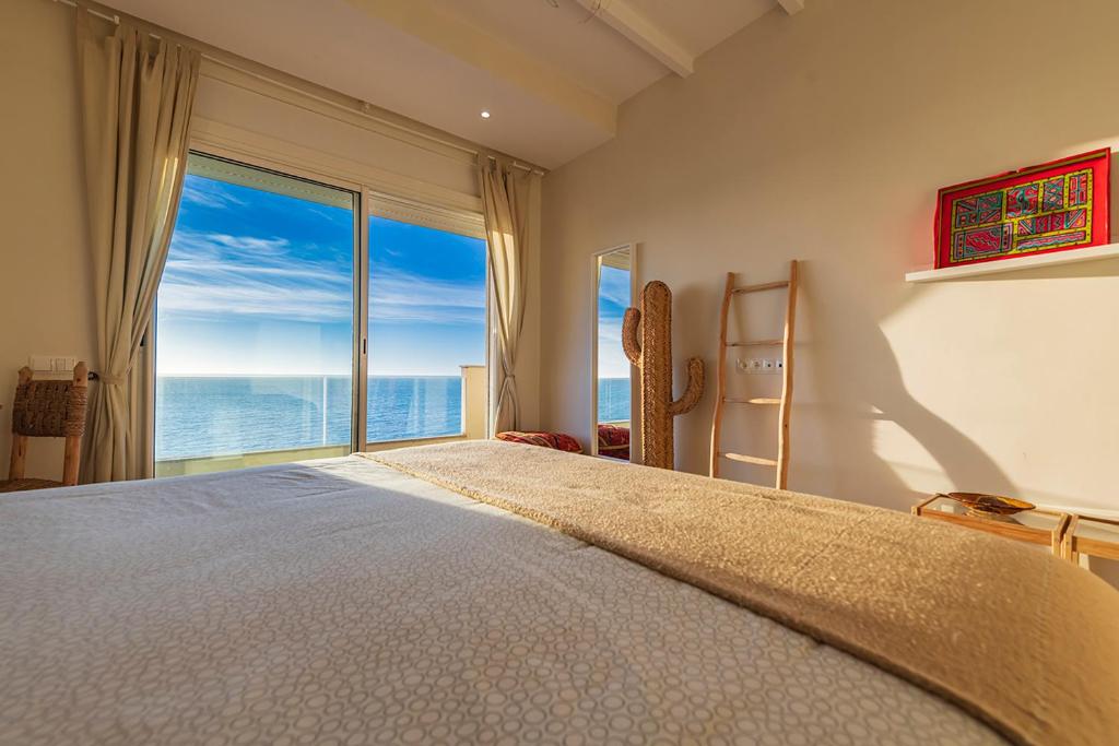 Postel nebo postele na pokoji v ubytování Kite House Dakhla