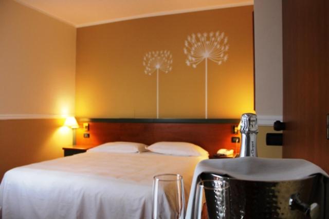 Postel nebo postele na pokoji v ubytování DOMUS Grand Hotel