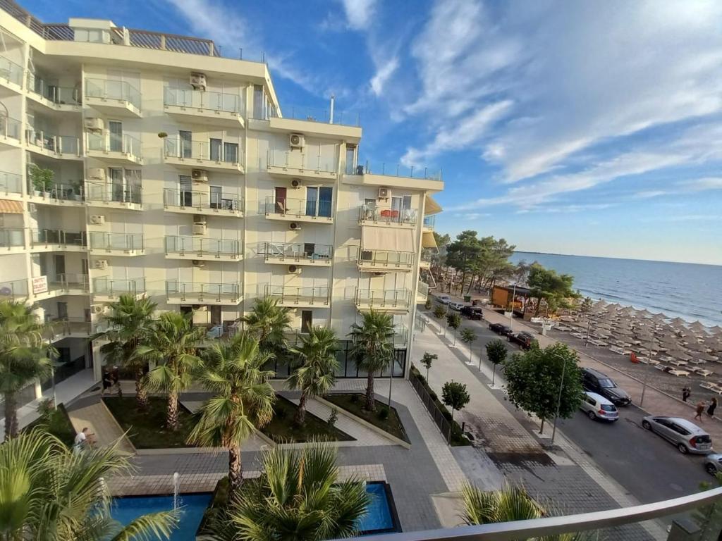 a view of a hotel and the ocean at Sea View Mario's Studio in Sakës
