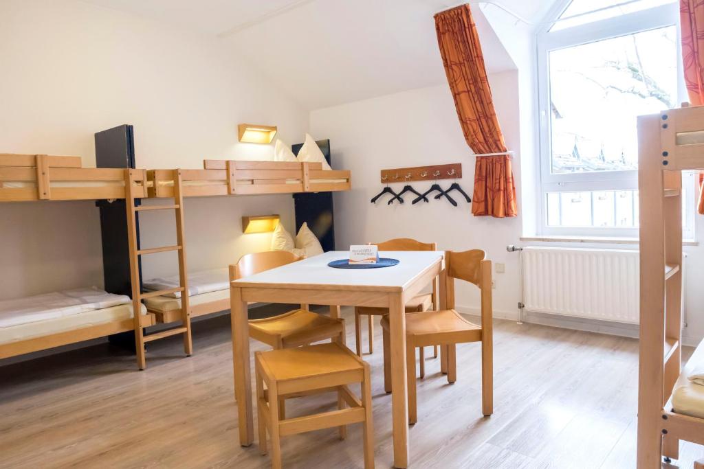 Postel nebo postele na pokoji v ubytování Jugendherberge Kappeln