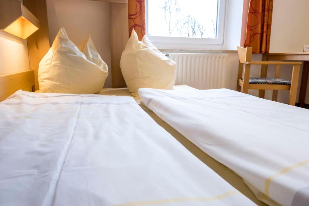 Postel nebo postele na pokoji v ubytování Jugendherberge Kappeln