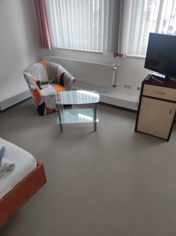 TV a/nebo společenská místnost v ubytování Zimmer am Jüdenhof