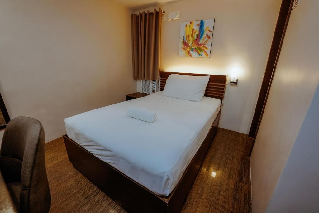 Postel nebo postele na pokoji v ubytování Emerald Boutique Hotel