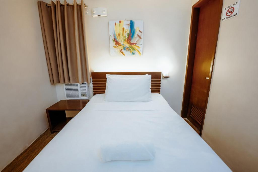 Postel nebo postele na pokoji v ubytování Emerald Boutique Hotel