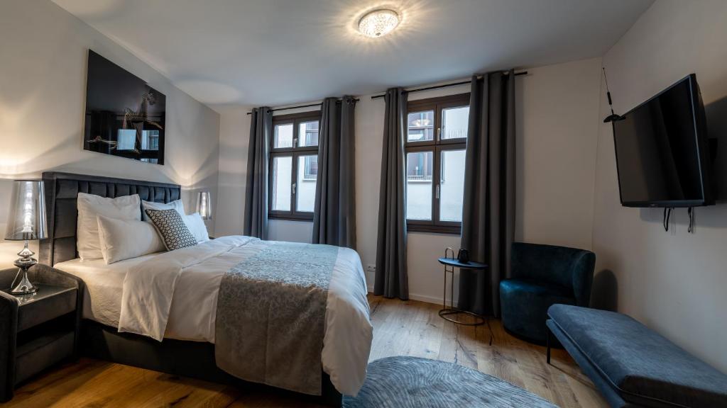Postel nebo postele na pokoji v ubytování Suite Home Apartments