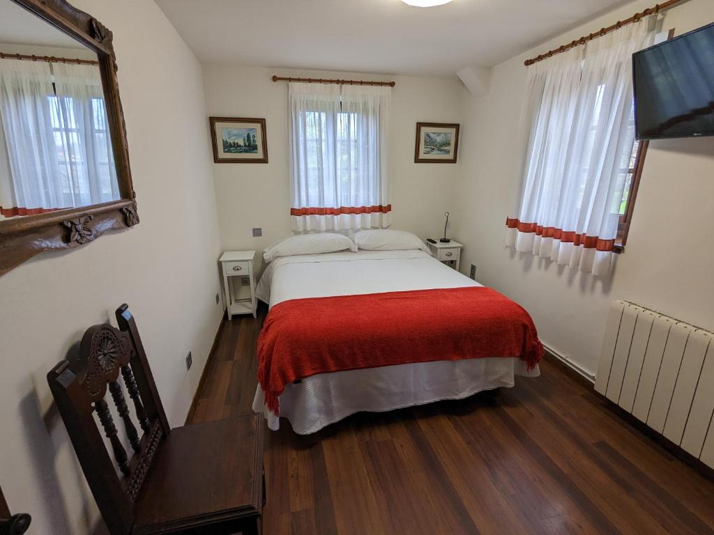 A bed or beds in a room at Posada Revolgo