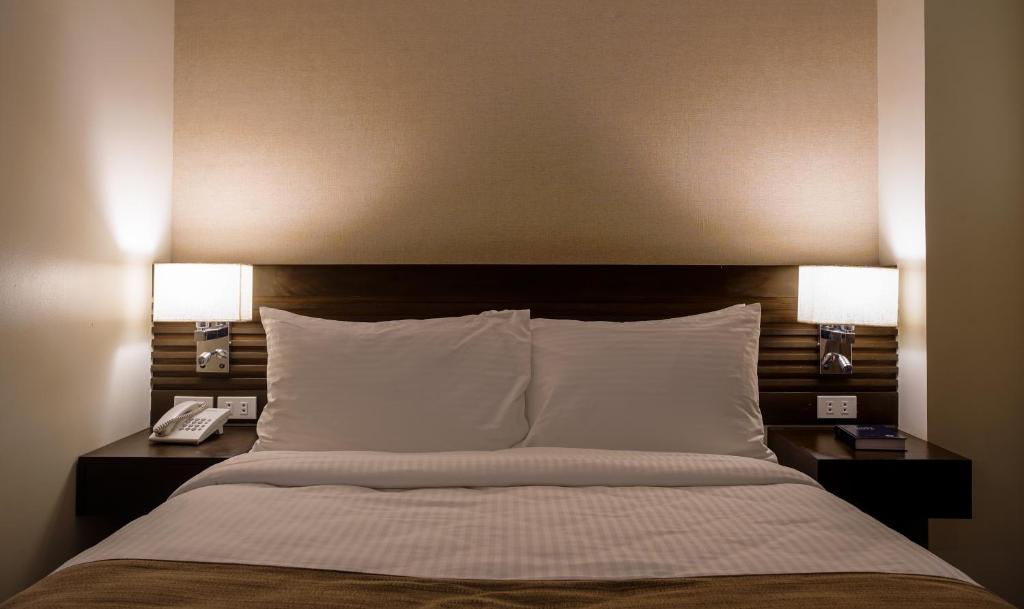 Postel nebo postele na pokoji v ubytování Hotel Areca