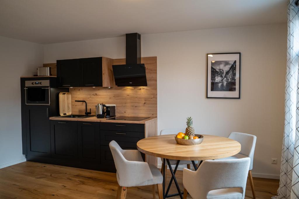 Kuchyň nebo kuchyňský kout v ubytování Suite Home Apartments