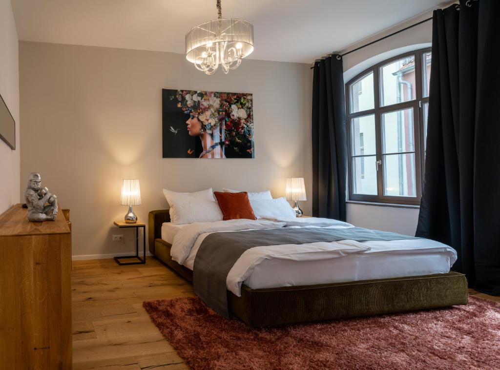 Postel nebo postele na pokoji v ubytování Suite Home Apartments