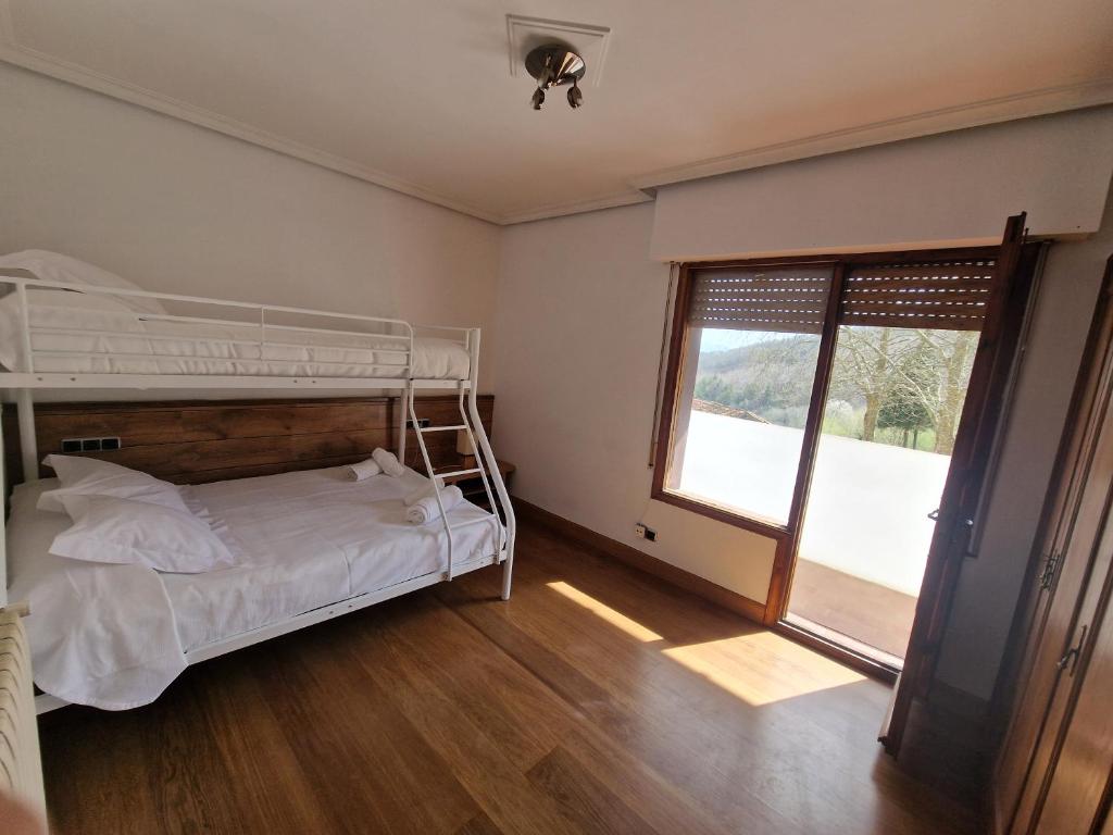 Postel nebo postele na pokoji v ubytování Hostal Lizuniaga