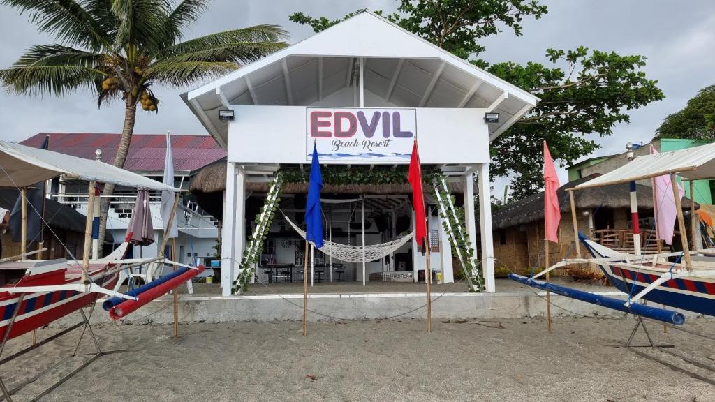 a building with a sign that says ewell on it at EDVIL BEACH RESORT 
