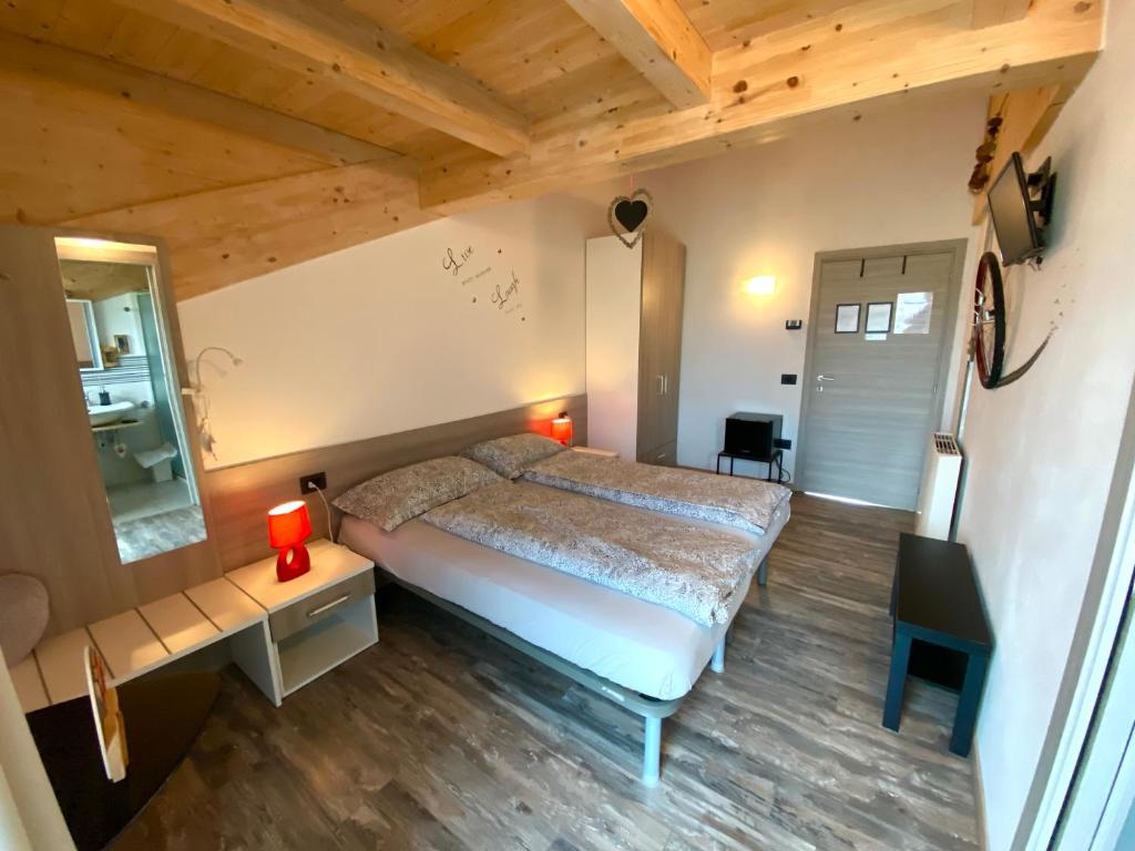 Postel nebo postele na pokoji v ubytování B&B A.R.C.O.