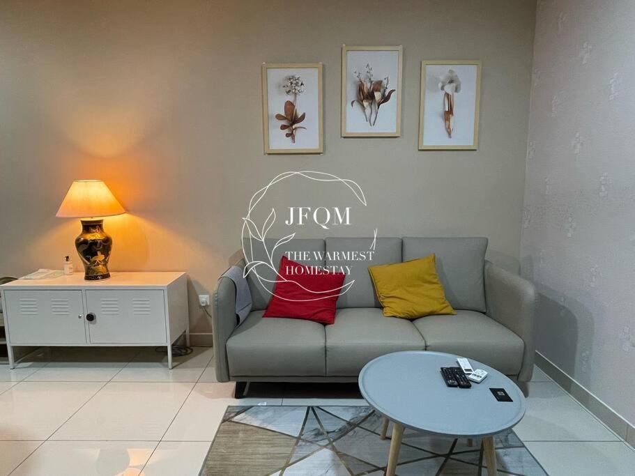 a living room with a couch and a table at Liberty ARC - Greenary & Warmest (Wifi) (2-3pax) in Ampang